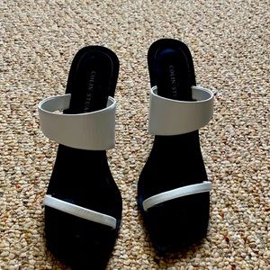 White/black open toe heels.